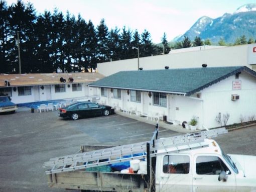 All Purpose Roofing Motel roof installation winter blurry