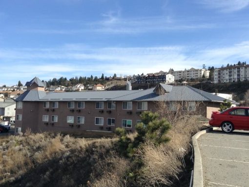 All Purpose Roofing grey hotel metal roof photo